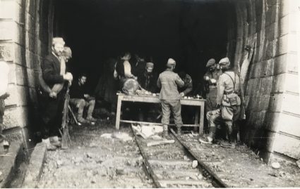 Major Archie Jack and JVuO engineers take shelter in a tunnel leading to the Lim railway bridge near Visegrad, in order to prepare charges for its destruction. (IWM, London, Documents archive 12697)