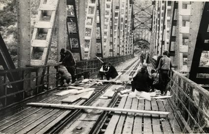 Major Archie Jack and JVuO engineers laying their charges on Lim railway bridge. (IWM, London, Documents archive 12697.