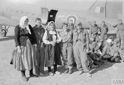 Partisan women after landing in Bari next to a C-47 aircraft. (IWM, London, photographic archive, CNA 3069)