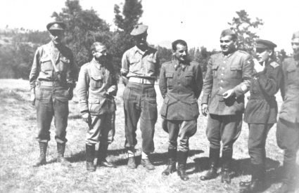 A group of senior Partisan officers and members of the Maclean Military Mission pause for a group photograph in the woods. (Private Collection of Mrs. Louise Russell)